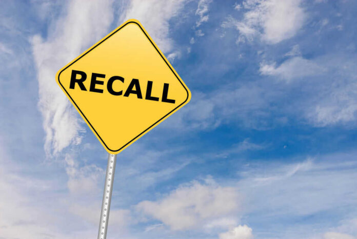 shutterstock_529192612 Yellow sign with RECALL text against blue sky.