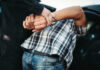 Pre-Dawn Raid SHOCKS America Person in handcuffs arrested by police officer.