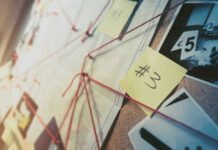 Mystery BOMBSHELL: Strange Shape Emerges Investigation board with photos, notes, and red string.