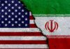 Iran Plot Near US Base? A cracked surface displaying the flags of the USA and Iran