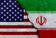 Iran Plot Near US Base? A cracked surface displaying the flags of the USA and Iran