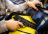 Mom’s Gift, School Attack – Who Pays? Kid placing handgun inside a backpack on desk
