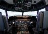 Interior view of an airplane cockpit with various instruments and controls