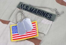 Marine Indicted After Murder US Marines uniform with dog tags and American flag patch