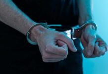 FBIjobs Hack Twist: Negotiator in Cuffs Close-up of hands in handcuffs