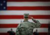 TRUMP Approves Army Firing Squad A military personnel saluting in front of a large American flag