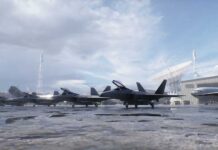 Stealth fighter jets parked on a wet airbase apron