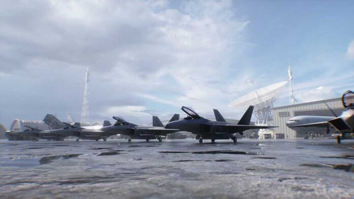 Stealth fighter jets parked on a wet airbase apron