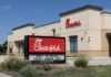 Human First Shocker At Chick-fil-A Exterior view of a Chick-fil-A restaurant with a promotional sign
