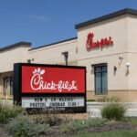 Human First Shocker At Chick-fil-A Exterior view of a Chick-fil-A restaurant with a promotional sign