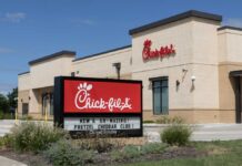 Human First Shocker At Chick-fil-A Exterior view of a Chick-fil-A restaurant with a promotional sign