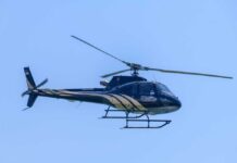 NEWS ALERT: Medevac Down – Dead Bodies, One Missing A helicopter flying against a clear blue sky