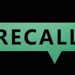 Green speech bubble with the word recall on a black background