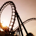 Roller coaster loops at sunset