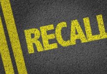 Highway Blackout Risk Triggers Recall Yellow 'RECALL' text on a dark asphalt surface