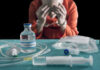 Execution Disaster Triggers Uproar Blurred hospital room with multiple patients and nurses