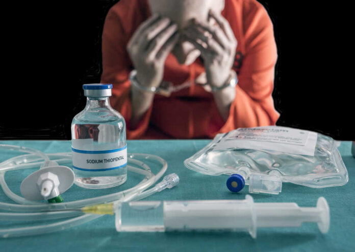 Prisoner,Handcuffed,To,Death,By,Lethal,Injection,,Vial,With,Sodium Blurred hospital room with multiple patients and nurses